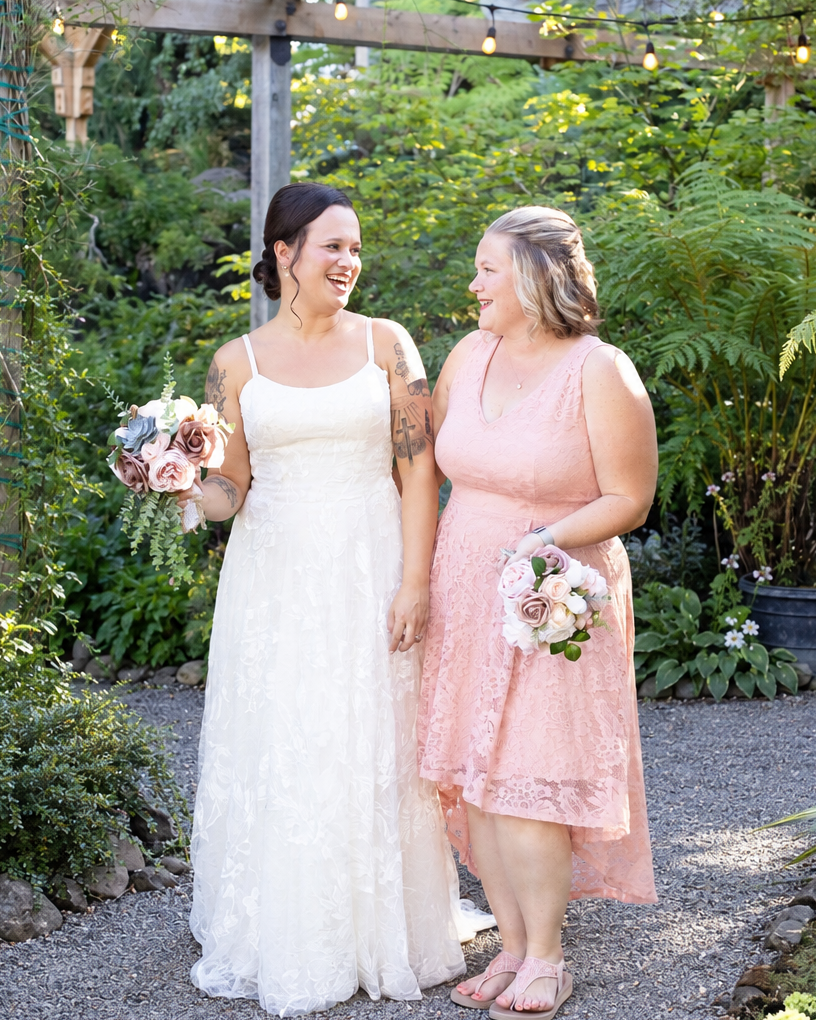 Two wedding coordinators preparing a forest ceremony space together